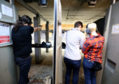 Kayla Harris, left, fires a weapon, as Pink Pistols Oakland chapter coordinator Darcy Nelson, center, teaches her partner Alexandria Kellner, all of Oakland, how to shoot firearms at the San Leandro Shooting Range in San Leandro, Calif., on Wednesday, April 12, 2017. It was Kellner's second time attending the Pink Pistols program, which is an organization dedicated to teaching LGBT how to use firearms for self-defense. (Ray Chavez/Bay Area News Group)